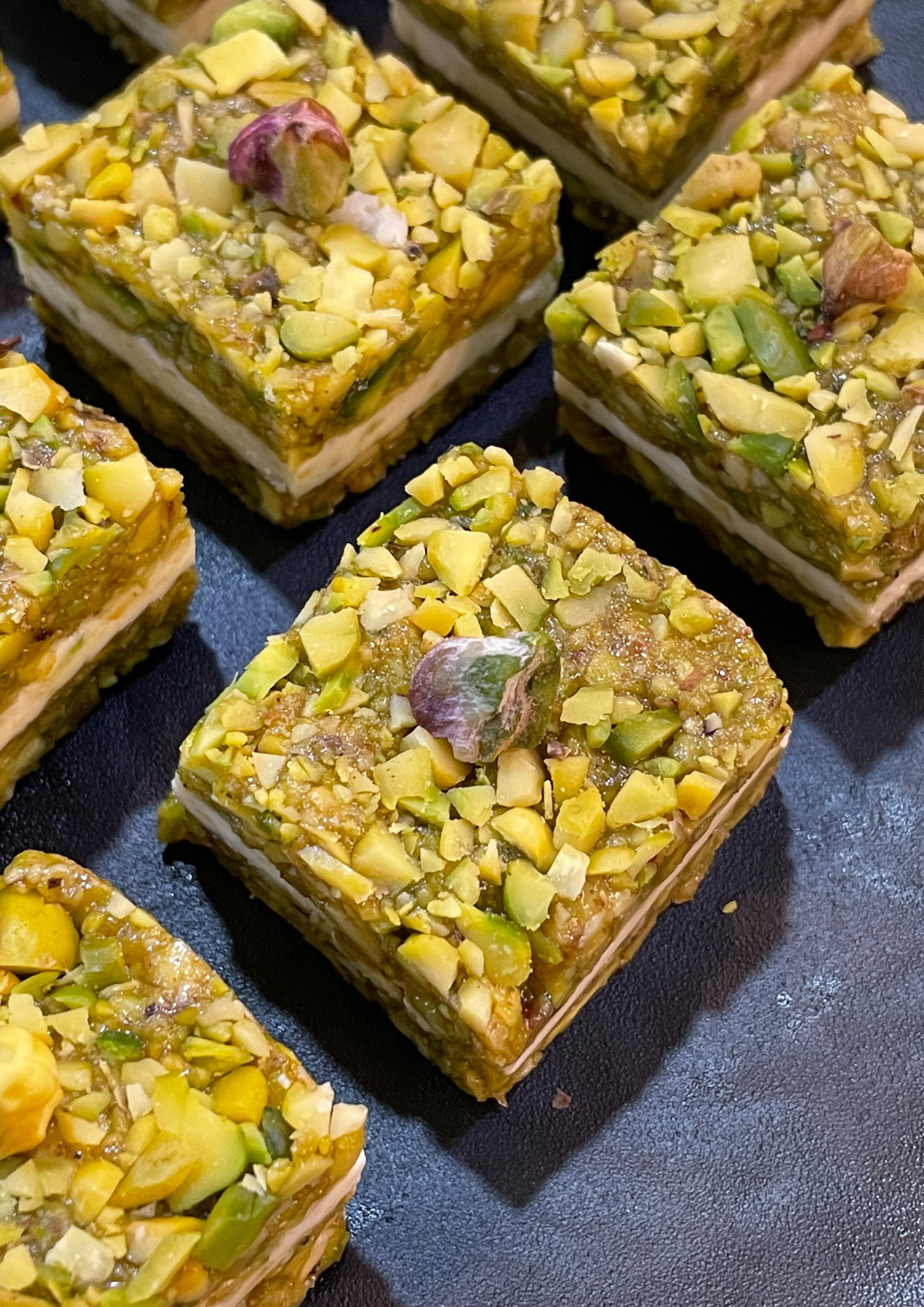 Pistachio crumbles sandwiched with white chocolate  - 250gms
