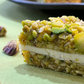 Pistachio crumbles sandwiched with white chocolate  - 250gms