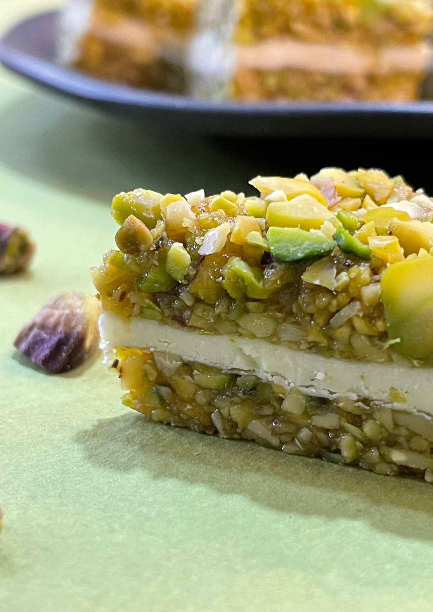 Pistachio crumbles sandwiched with white chocolate  - 250gms